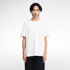 Regular Fit Volvo T-shirt in white, worn by a male model. This short-sleeve tee is designed for a more relaxed fit.