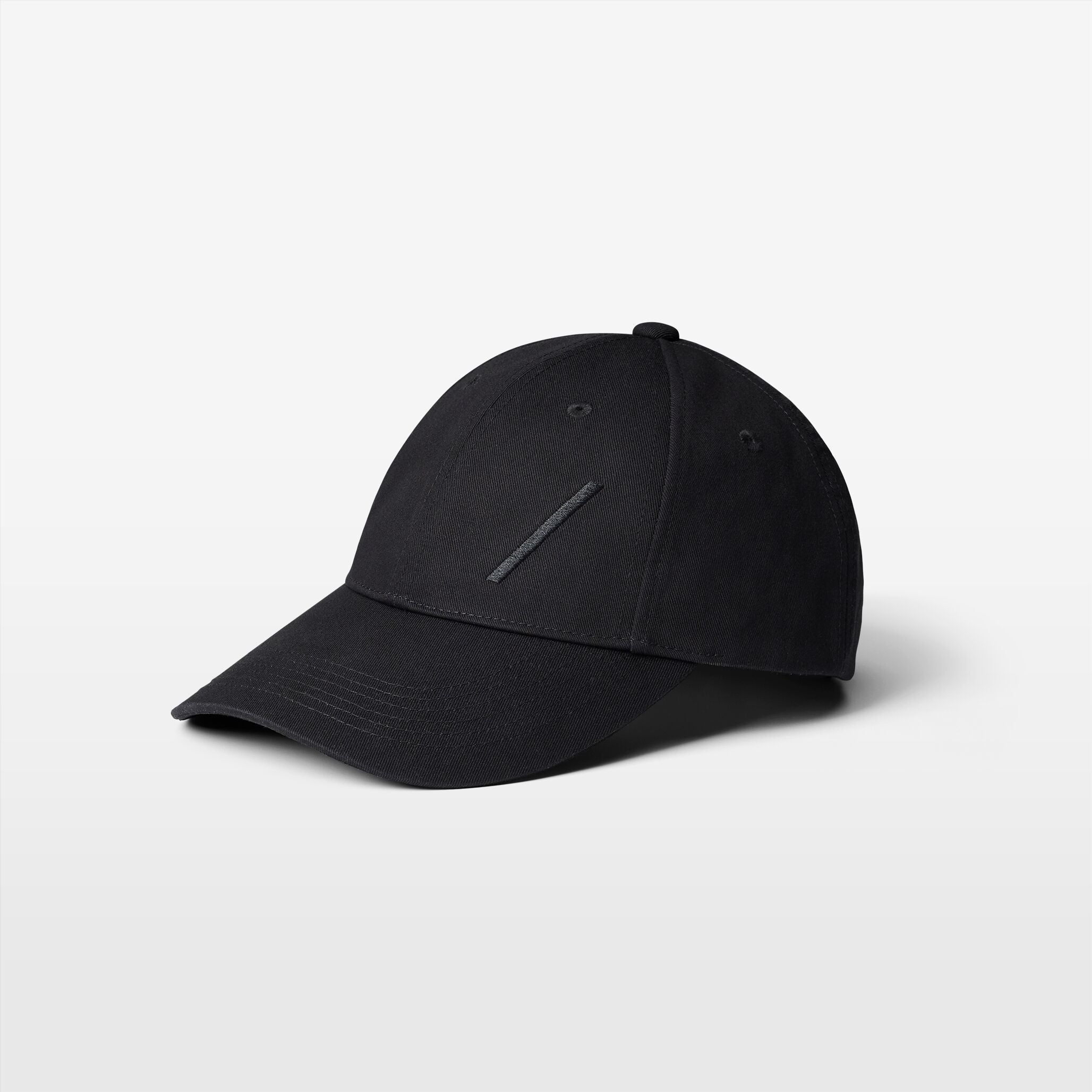 Volvo Classic Cap in black, featuring an embroidered diagonal logo. Cut-out image with a plain background. 