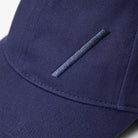 Volvo Classic Cap in navy, featuring an embroidered diagonal logo. Cut-out image with a plain background. 