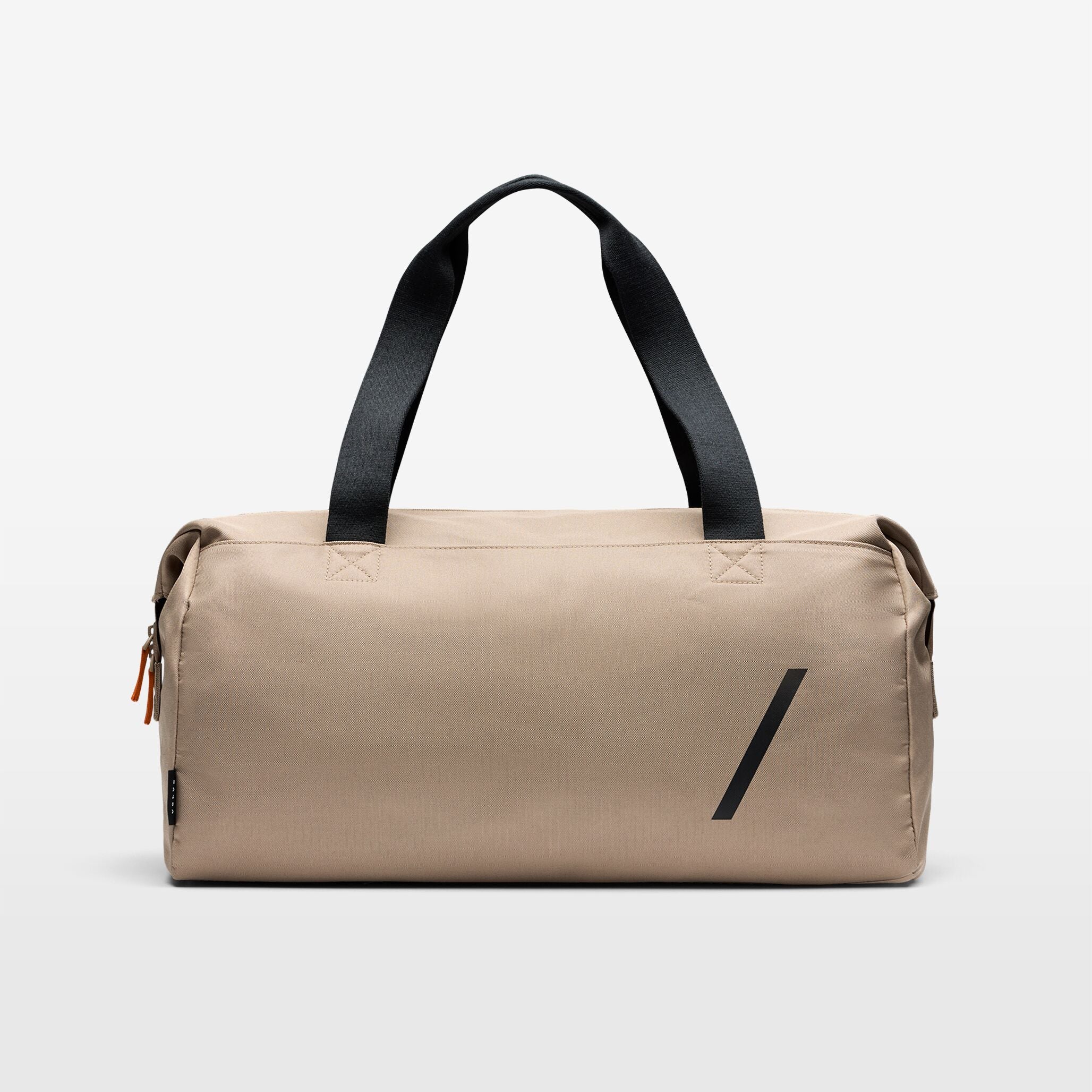 The taupe coloured Volvo Duffle Bag against a white background, with shoulder and cross-body straps, water-repellent exterior and Volvo Diagonal logo.