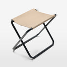 Overhead view of the Folding Stool. Taupe-coloured fabric features the Volvo logo, while a sturdy steel frame holds up to 150 kg.