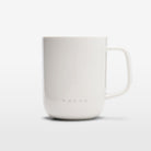 The Volvo Mug in off-white colour against a white background. We see the large ceramic clay mug with handle in an elegant Scandinavian design. 