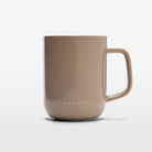 The Volvo Mug in taupe colour against a white background. We see the large ceramic clay mug with handle in an elegant Scandinavian design. 