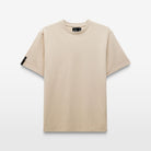 Cut-out image of the Regular Fit Volvo T-Shirt in dune. Short-sleeve tee highlights its relaxed fit, a diagonal logo on the sleeve. The neck tag features the message: For Life, For Lives, For Living. 