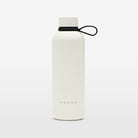 The Volvo Thermos Bottle in off-white against a white background. We see the rust-proof stainless steel design, tight sealing ring, Volvo logo near the bottom, and strap for easy carrying.