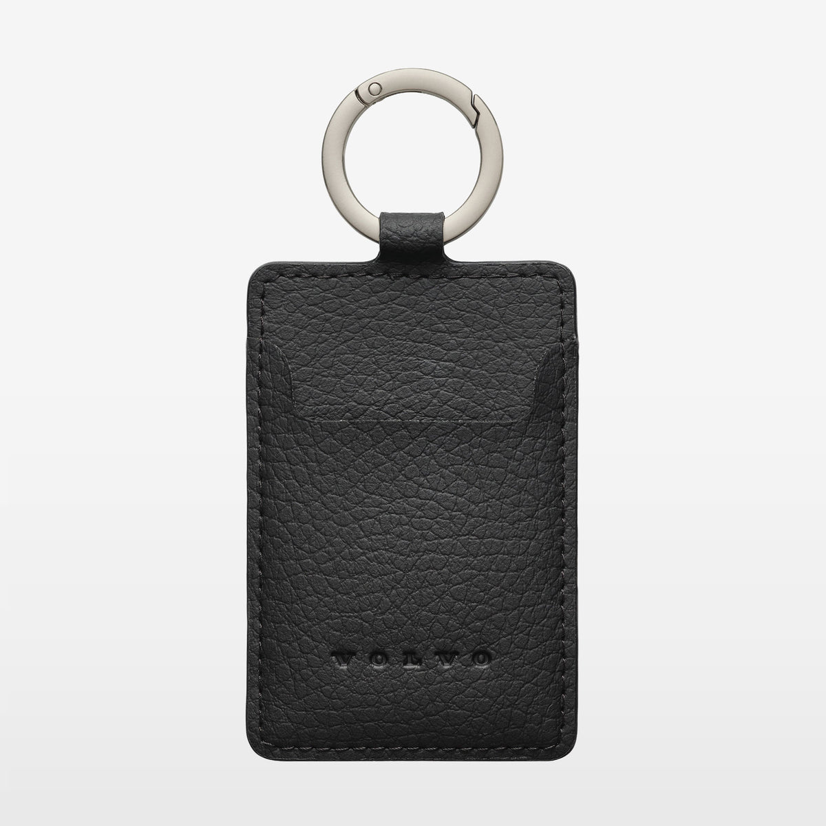 A black textured card holder with a silver metal key ring, featuring the embossed Volvo logo near the bottom, set against a light gray background.