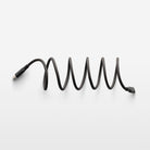 Coiled black cable on a white background