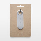 Reflective strap on a beige card with Volvo branding