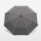 Gray umbrella on a light gray background