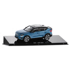 Model car of a blue SUV on a black platform with 'C40' branding.