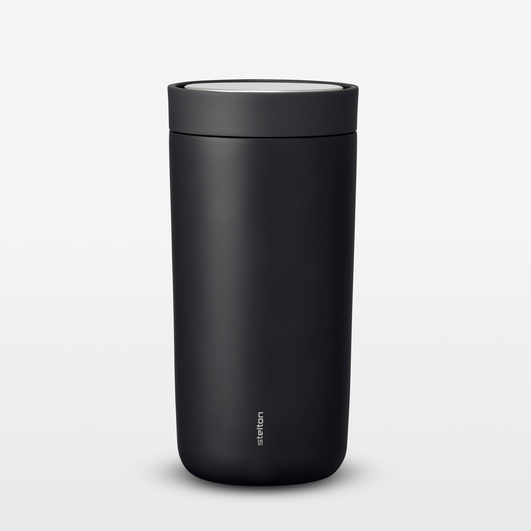 Black thermos mug on a light gray background