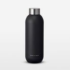 Black water bottle with silver cap on a light gray background