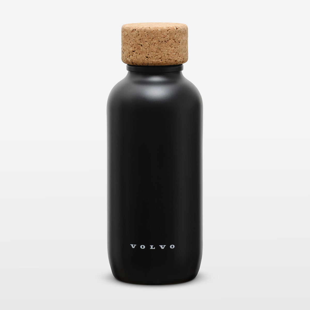 A matte black Volvo water bottle with a natural cork stopper, shown on a clean white background.