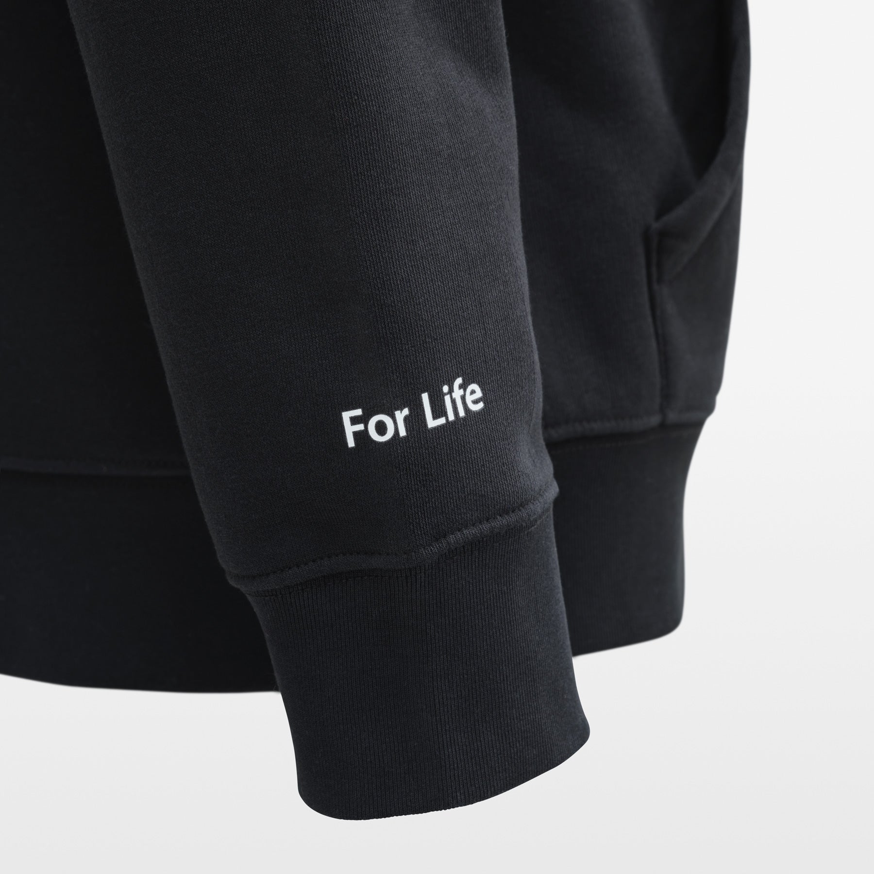 Black hoodie with 'For Life' text on a light gray background